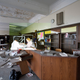 Illustration for article titled Composite photos show a Detroit school before and after it was abandoned